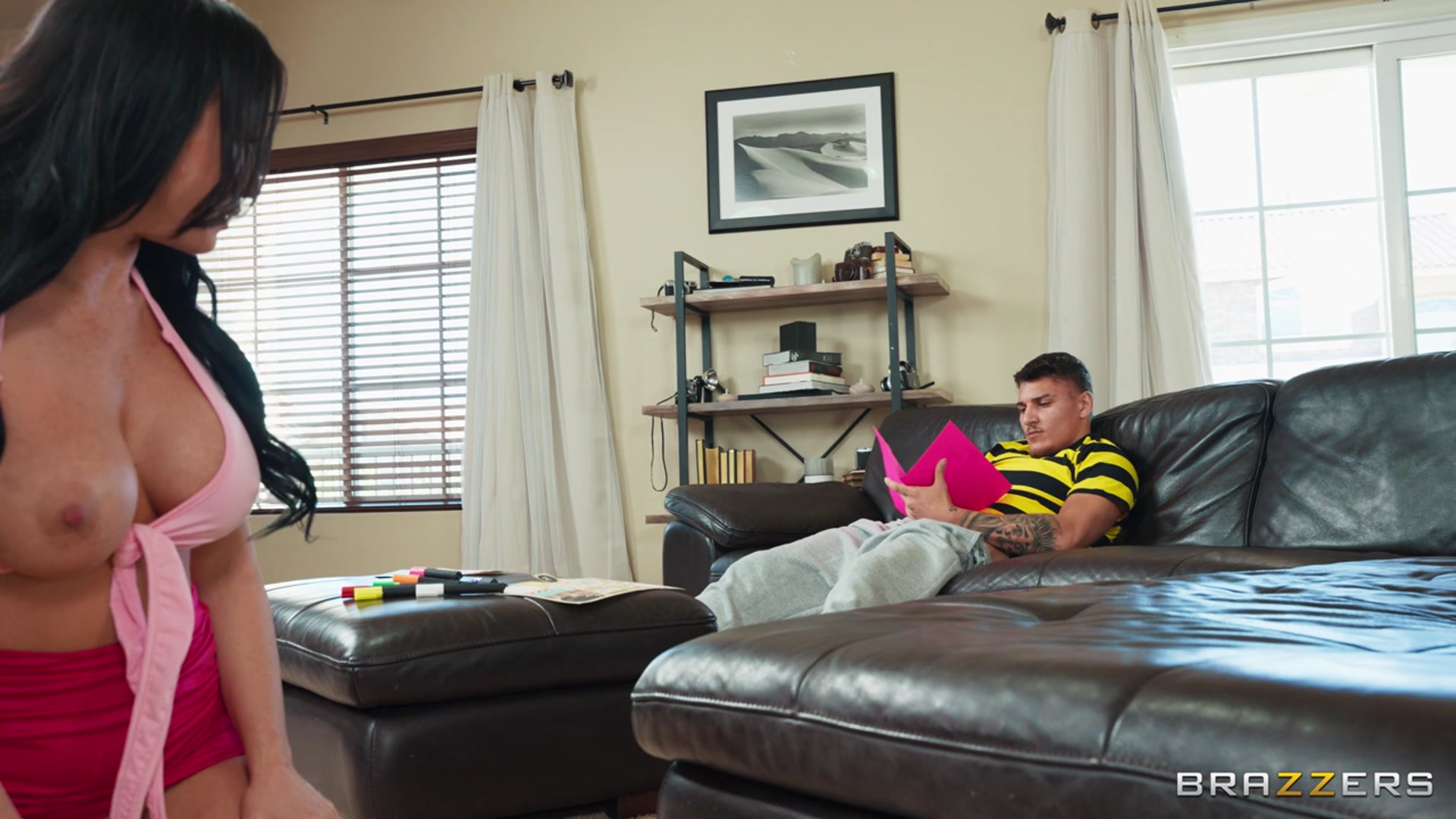 Jennifer White is the new smoking hot stepmother to Victor Ray. Victor’s dad wants him to get to know Jennifer while he’s out, but Victor can’t take his eyes off her amazing ass. He tries to cool off by chilling in the living room, but pretty soon Jennifer’s bent over, ass up, cleaning in his face. Victor’s got a major boner and decides to conceal it in Stepmother’s Day card his dad has put him in charge of making, and designs a sneaky gloryhole to stroke his cock through. Jennifer can tell he’s up to no good, so she crawls over to his lap to investigate. Jennifer opens the card to be surprised by a giant facial but she’s not mad, she wants more!